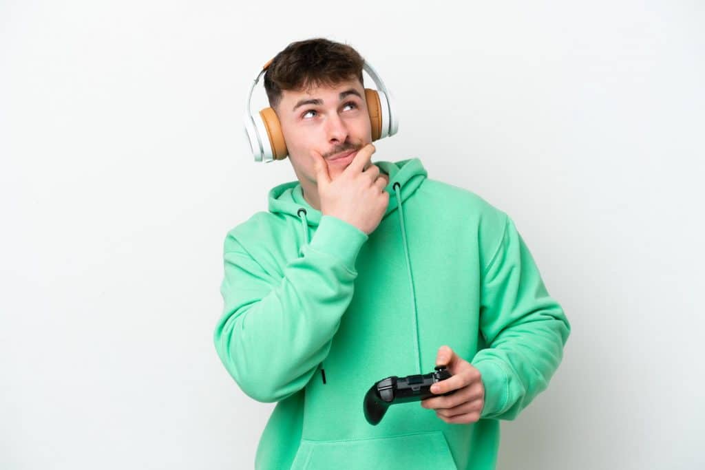Young Guy With Green Sweatshirt Thinking About A Question